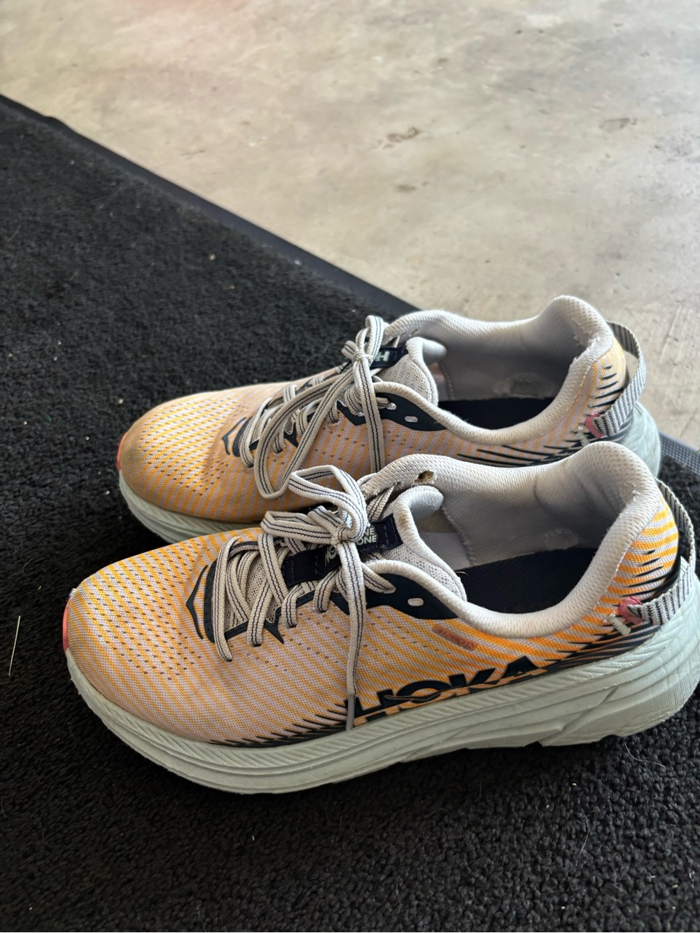 Women’s Athletic Running Shoes in orange by Hoka